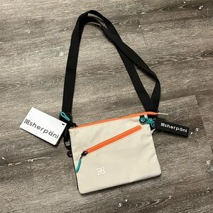 Sherpani Zoom Crossbody Bag - Beige with Orange and Teal Accents